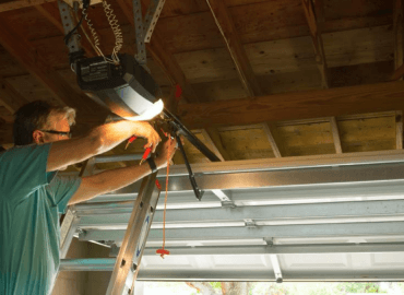 Landscaping Options A Photograph of a Man Installing Metal Support For Lighting In a Garage